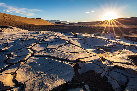 Sunburst Over Cracked Dune Mud