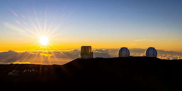 Sun Setting Over Mauna Kea Obseratories, Hawaii