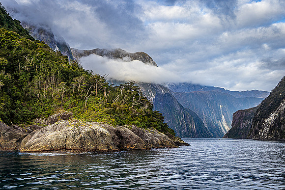 Small Boat Traversing Milford Sound